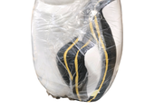 a plastic bag with a pair of shoes inside of it