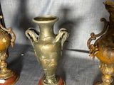 three vases sitting next to each other on a table