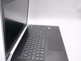a laptop that is sitting on a white table