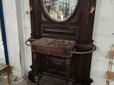 a large mirror on a stand in a room