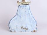 a blue vase with a crown on top of it