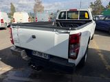 a white pick up truck parked in a parking lot
