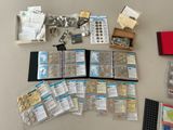 a lot of coins and other items that are on the table