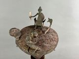 statue of a man riding a horse on top of a tortoise