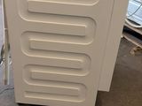 a refrigerator that is sitting in the middle of a room