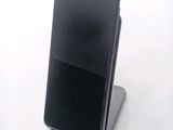 a cell phone that is sitting on top of a stand