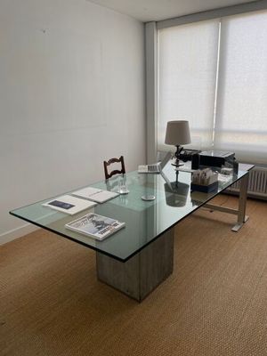a glass table with a glass top in a room