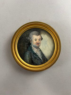 portrait of a gentleman in a black coat and white shirt