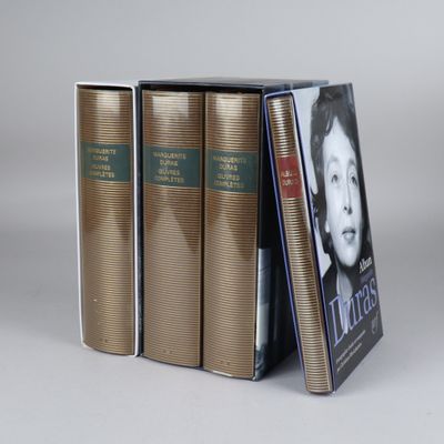 three books are stacked on top of each other on a table