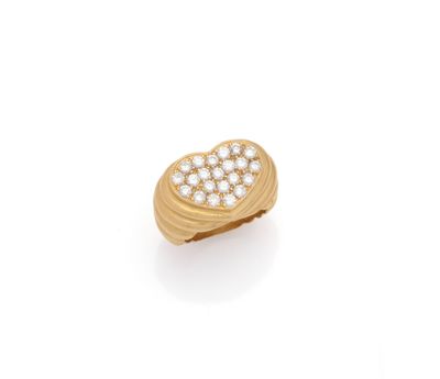 an 18k gold and diamond heart ring