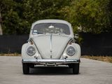 a white vw beetle parked on the side of the road