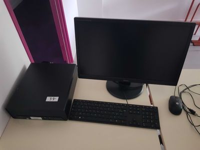 a desktop computer sitting on a desk with a keyboard and mouse
