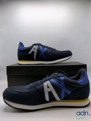a pair of new balance shoes in a box