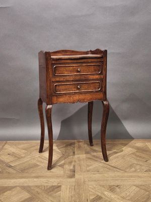an image of a small wooden table with a drawer on it