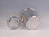 two clear cups with gold rims are sitting on a white surface