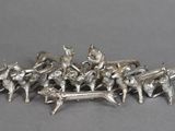 a lot of silver figurines sitting on top of a table