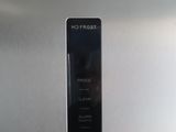 a close up of a stainless steel refrigerator with a no frost button