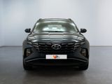 the front view of a black car in a white room