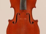 an old violin with a bow hanging from it ' s back