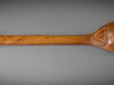 an image of a wooden spoon on a gray surface