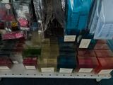 many different colored soaps on a shelf in a store