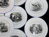 several plates with black and white images of people on them
