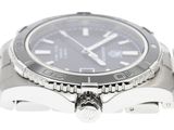 a silver watch with a black face on a white background