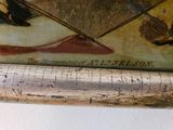 a close up of a baseball bat with a painting on it