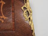 a wooden cabinet with a clock on top of it