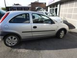 a silver car that is parked in a parking lot