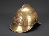 brass fireman ' s helmet with crest and crest on the side