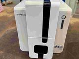 an image of a white machine sitting on top of a wooden table