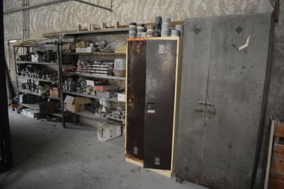 a refrigerator in a room with a lot of items on the shelves