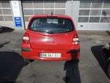 a red car that is parked in a parking lot