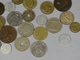 a lot of coins that are on the table