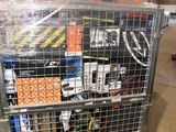 a metal cart with many items in it in a warehouse