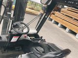 a forklift driver ' s view of the driver ' s seat of a forklift