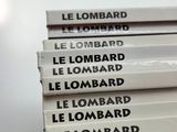 four books stacked on top of each other on a table