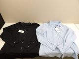 two shirts are sitting on a table with a price tag on them