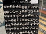 a close up of a display case with lots of earrings on it