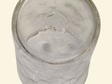 a glass jar with a lid on a white background