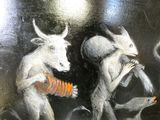 a painting on the wall of a man and a goat