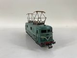a toy train on a white surface with a white background