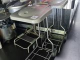a kitchen with a table and chairs in the middle of the room