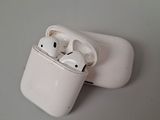 two airpods sitting on top of each other on a table