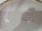 a close up of a plate with writing on it