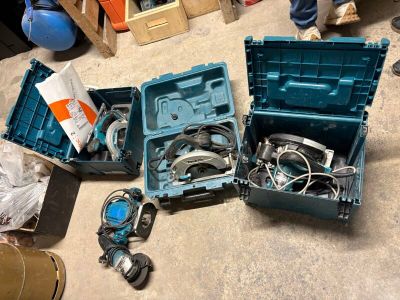 many tools in a blue box on the floor