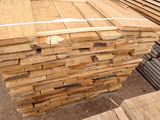 a pile of wood that is stacked on top of each other
