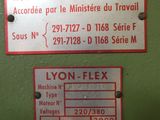 two signs on the wall of a machine room