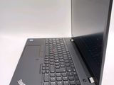 a laptop that is open on a white surface